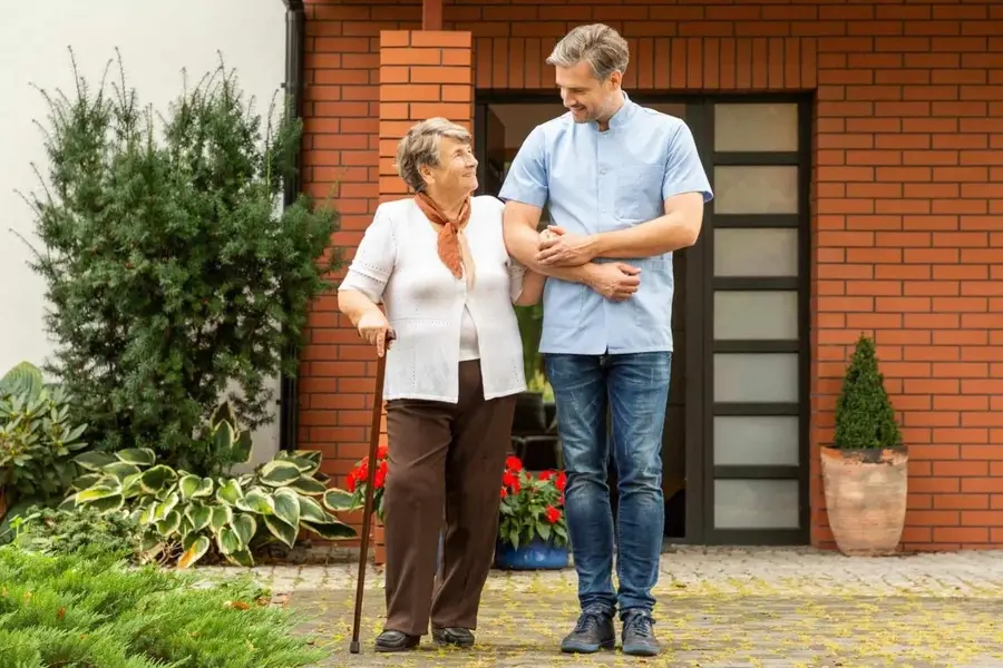 A Handled caregiver and senior client enjoying time together